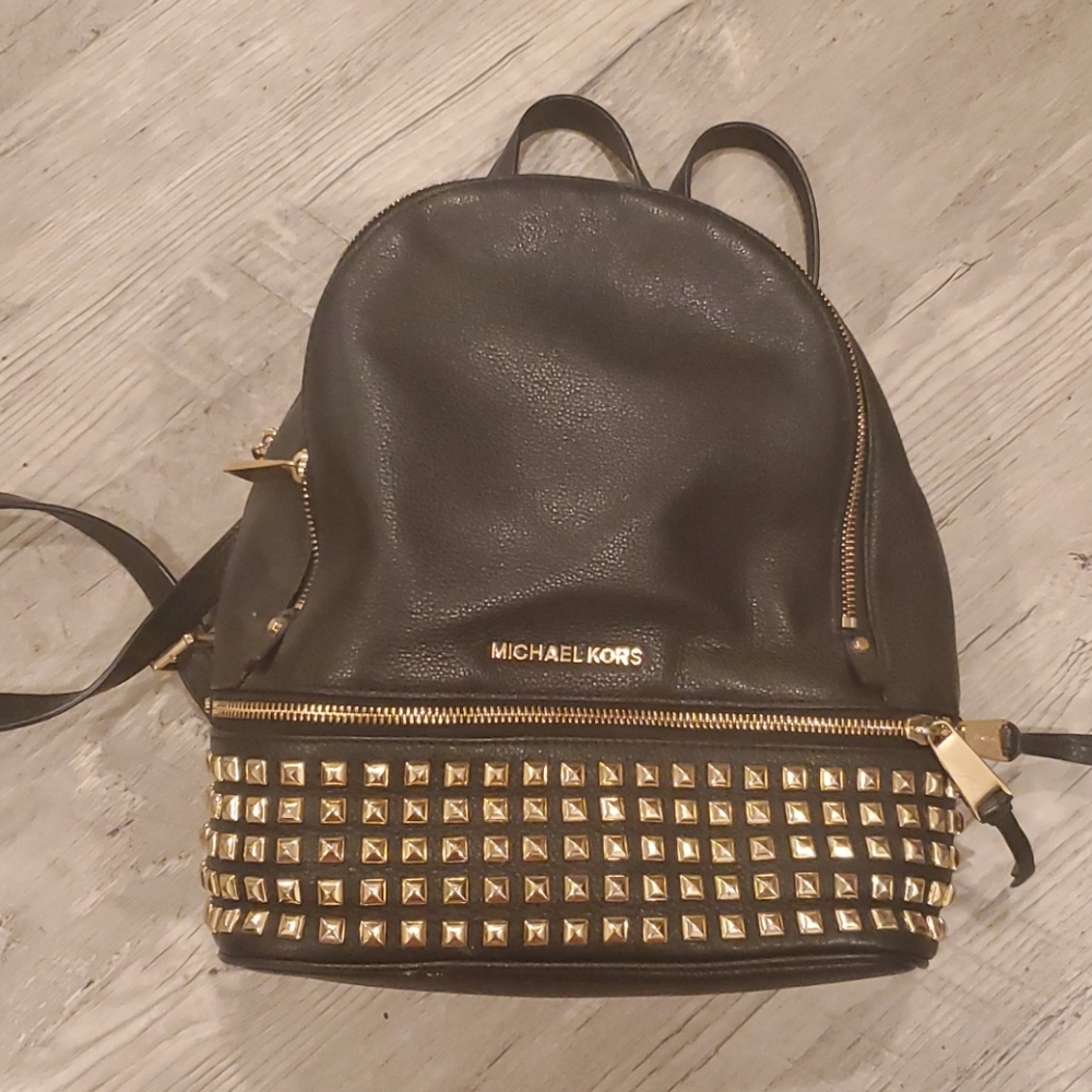 Small gold and black backpack